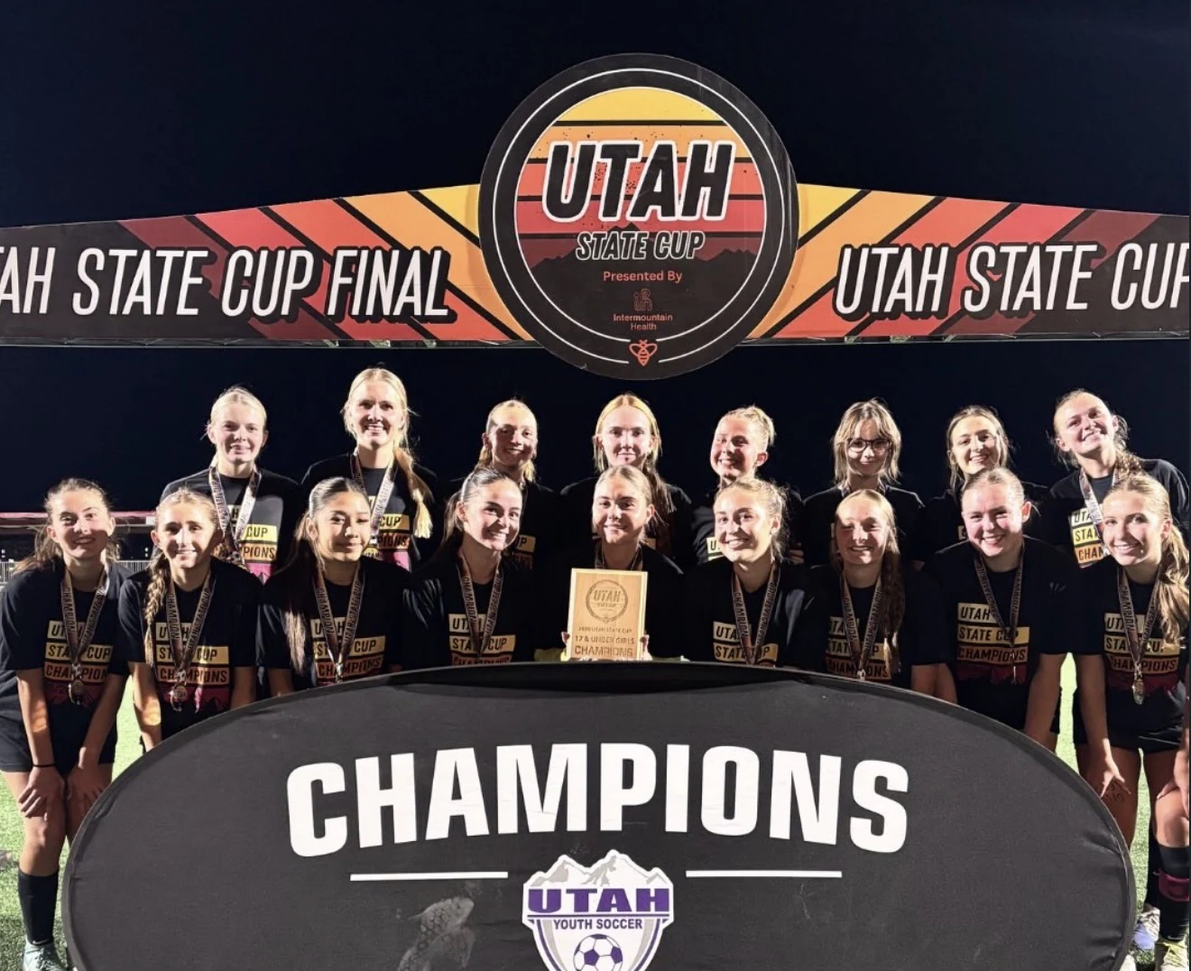 Fire FC girls celebrate their State Cup championship.
