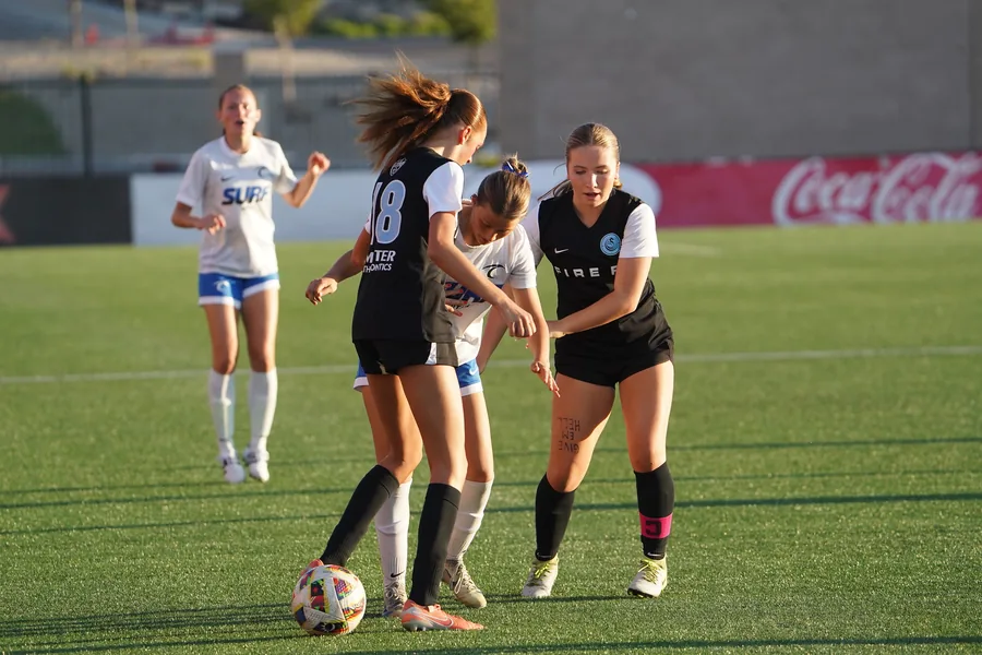 Fire FC teammates connect during the State Cup final against Utah Surf.